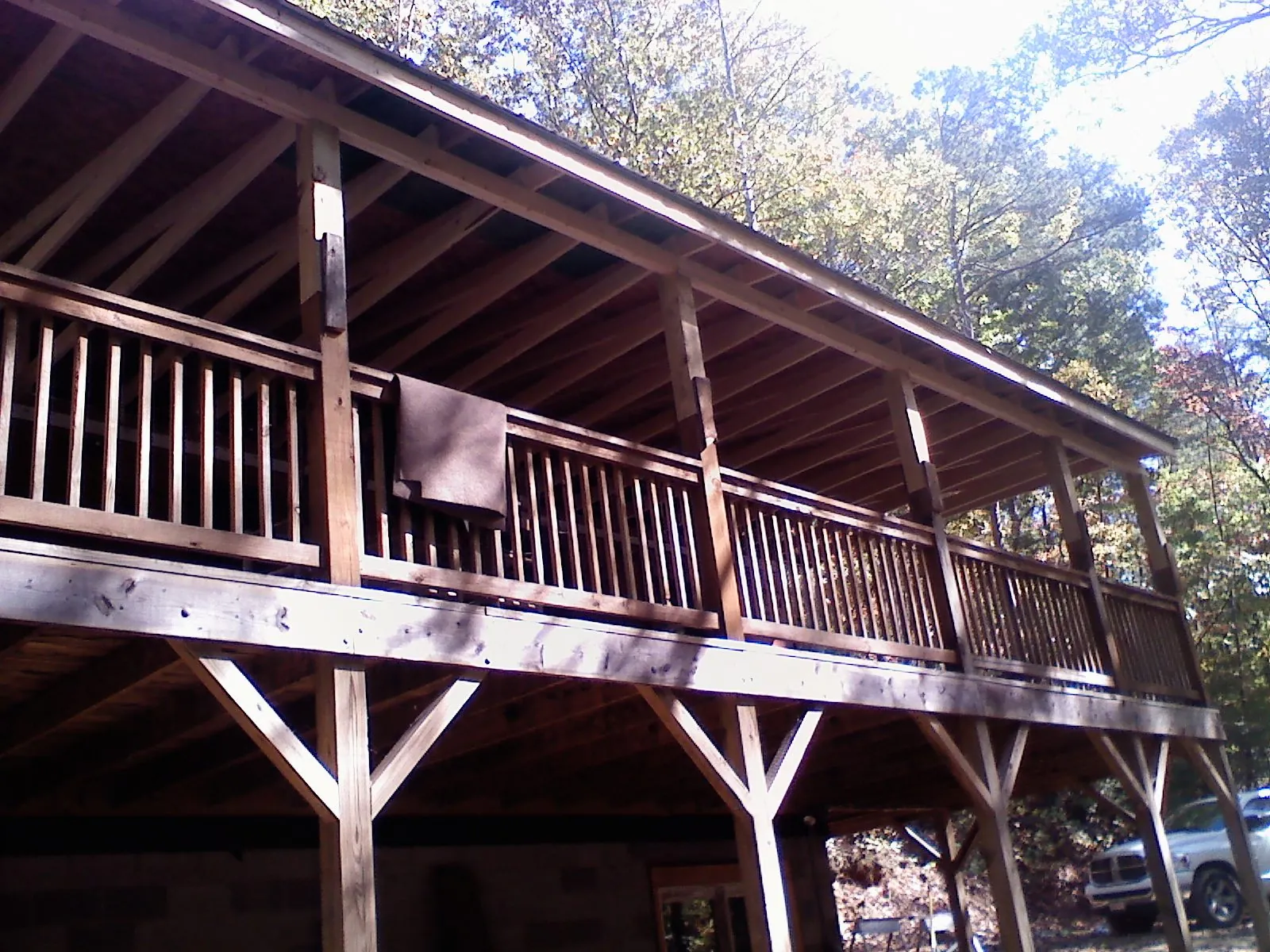 Timber framing under a new elevated porch and deck — Roof Leak Repair in Maybee by Roofing Brothers